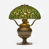 Vine Border table lamp by Tiffany Studios, c. 1910, leaded glass, patinated bronze, sold Sep 2022