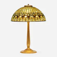 Pomegranate table lamp by Tiffany Studios, c. 1910, leaded glass, patinated bronze, sold Sep 2022