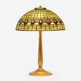 Pomegranate table lamp by Tiffany Studios, c. 1910, leaded glass, patinated bronze, sold Sep 2022