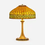 Greek Key table lamp by Tiffany Studios, c. 1910, leaded glass, patinated bronze, sold Sep 2022