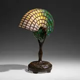 Nautilus desk lamp by Tiffany Studios, c. 1910, leaded glass, patinated bronze, sold Sep 2022