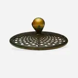 Ball heat cap by Tiffany Studios, c. 1910, patinated bronze, Favrile glass, sold Sep 2022