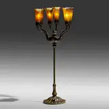 Six-light Blossom table lamp by Tiffany Studios, c. 1910, patinated bronze, hand-blown Favrile glass, sold Sep 2022