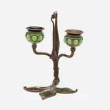 Fleur-de-Lis candleholder with snuffer, model 1232 by Tiffany Studios, c. 1910, patinated bronze, hand-blown glass, sold Sep 2022