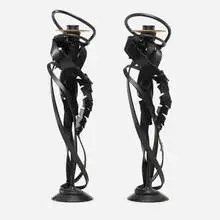 Double Shear candlesticks, pair by Albert Paley, 2014, forged mild steel with a blackened patina, removable brass bobeches (collars), sold May 2022