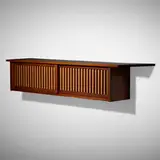 Hanging Wall cabinet by George Nakashima, 1968, American black walnut, pandanus cloth, sold May 2022