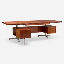 Executive desk, model T96 by Osvaldo Borsani, 1956, rosewood, chrome-plated steel, lacquered steel, sold Jun 2025