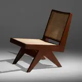 Armless easy chair from Chandigarh by Pierre Jeanneret, c. 1960, teak, cane, upholstery, sold May 2022