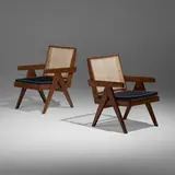 Lounge chairs from the Punjab Engineering College, Chandigarh, pair by Pierre Jeanneret, c. 1955, teak, cane, upholstery, sold May 2022