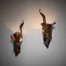 Georges Charpentier, Sconces, pair, c. 1970, forged and patinated steel, brass