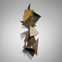 Early wall sculpture by Paul Evans, c. 1958, welded, pierced, and painted steel, brass, gold leaf, sold Jun 2025