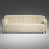 Jacob Kjær, Sofa, c. 1955, stained beech, sheepskin, brass