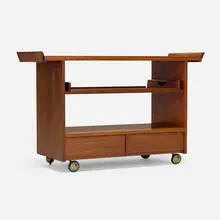 Rare rolling tea cart by George Nakashima, c. 1965, American black walnut, brass, sold Jun 2025