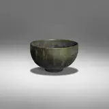 Tea bowl by Gertrud and Otto Natzler, c. 1957, earthenware with Green Black Mat glaze, sold May 2022