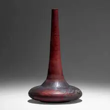 Rare squat bottle form with long neck by Gertrud and Otto Natzler, 1974, earthenware with Sang and Blue Nocturne Reduction Fired glaze with melt-fissures, skinning, and iridescence, sold May 2022