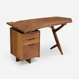 Special-order Conoid desk by George Nakashima, 1971, American black walnut, hickory, East Indian laurel, sold Jun 2025