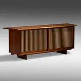 Sliding Door cabinet by George Nakashima, 1961, American black walnut, pandanus cloth, sold Jan 2022
