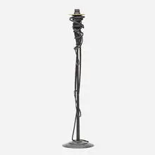 Tall candlestick by Albert Paley, 2001, forged steel with a blackened finish, removable brass bobeches (collars), sold Jan 2022