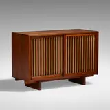 Sliding Door cabinet by George Nakashima, American black walnut, pandanus cloth, sold Jan 2022