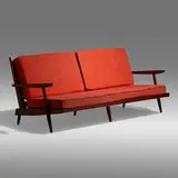 Settee with Arms by George Nakashima, 1961, American black walnut, upholstery, sold Jan 2022