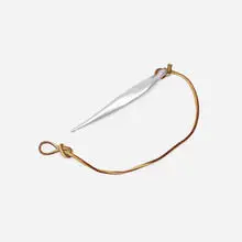 Crochet hook by Wharton Esherick, 1944, aluminum, leather cord, sold Jan 2022