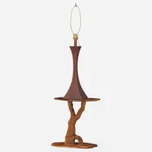 Table lamp and occasional table by Robert Whitley, c. 1975, 2008, carved and sculpted walnut, sold Jan 2022