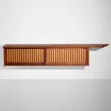Hanging cabinet by George Nakashima, 1963, American black walnut, pandanus cloth, sold Apr 2025