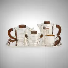Émile Puiforcat, Coffee and tea service, c. 1925, Sterling silver, silver-plate tray, rosewood