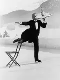 Alfred Eisenstaedt, Headwaiter René Breguet brings aperitifs to English guests at the skating rink of the Grand Hotel, Saint-Moritz
