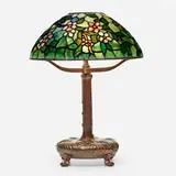 Apple Blossom table lamp by Tiffany Studios, c. 1910, leaded glass, patinated bronze, sold Jan 2022