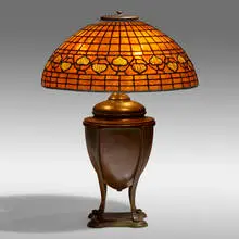 Vine Border table lamp by Tiffany Studios, c. 1910, leaded glass, patinated bronze, sold Jan 2022