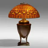 Vine Border table lamp by Tiffany Studios, c. 1910, leaded glass, patinated bronze, sold Jan 2022
