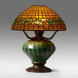 Rare Vine Border table lamp by Tiffany Studios, c. 1900, leaded glass, patinated bronze, sold Jan 2022