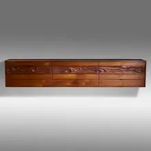 Wall-hanging chest by Phillip Lloyd Powell, c. 1970, carved and sculpted walnut, ebony, sold Sep 2021