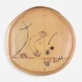 Untitled (Plate) by Peter Voulkos, 1979, glazed, gouged, incised, and gas-fired stoneware with clear glaze and porcelain pass-throughs, sold Sep 2021