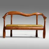 Phillip Lloyd Powell, Custom bench, c. 1965, carved and sculpted walnut, ebony, leather