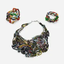 Joyce J. Scott, Neckpiece and two cuffs, woven glass beads, copper wire, leather, metal, buttons, pipe cleaners