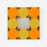 Alexander Girard, Wall mirror for Textiles & Objects, 1961, fabric over wood, brass, mirrored glass