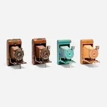 Kodak Petite cameras, set of four by Walter Dorwin Teague, c. 1930, enamel on metal, paper, leather, snakeskin, fabric, glass, sold Mar 2025