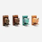 Walter Dorwin Teague, Kodak Petite cameras, set of four, c. 1930, enamel on metal, paper, leather, snakeskin, fabric, glass