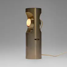 Table lamp, model 13068 by Angelo Lelii, c.1964, matte chrome-plated brass and steel, lacquered brass, sold Mar 2025