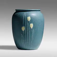 Rare vase with crocuses by Eva Russell for Grueby Faience Company, c. 1905, glazed earthenware, sold Sep 2021