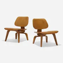 Pre-production LCWs, pair by Charles and Ray Eames, 1945, walnut plywood, rubber, sold Feb 2025