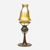 Jeweled candlestick by Tiffany Studios, c. 1910, patinated bronze, hand-blown Favrile glass, sold Sep 2021