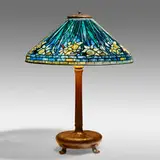 Rare blue Daffodil table lamp by Tiffany Studios, c. 1910, leaded glass, patinated bronze, sold Sep 2021