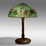 Dogwood Band table lamp by Tiffany Studios, c. 1910, leaded glass, patinated bronze, sold Sep 2021