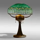 Vine Border table lamp by Tiffany Studios, c. 1910, leaded glass, patinated bronze, sold Sep 2021