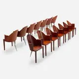Philippe Starck, Dining chairs from the Royalton Hotel, set of fourteen, 1988, pau rosa plywood, cast aluminum