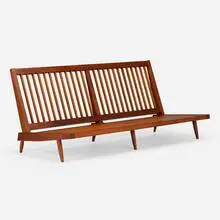 Early settee by George Nakashima, 1958, American black walnut, upholstery, sold Feb 2025