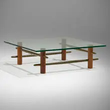 Rare coffee table by T. H. Robsjohn-Gibbings, c. 1952, walnut, brass, glass, sold Feb 2025